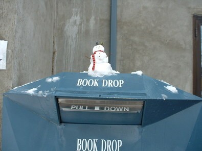 small-snowman-on-book-drop-by-ada-community-library.jpg