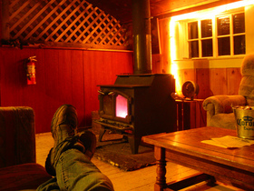 relaxing-by-wood-stove-by-Scrunchleface.jpg