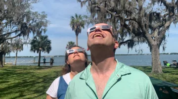 My wife and I looking up at a partial solar eclipse in Florida on April 8, 2024.