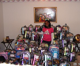 Taylor Rutledge showing the Katrina backpacks she made for the young victims of Hurricane Katrina.