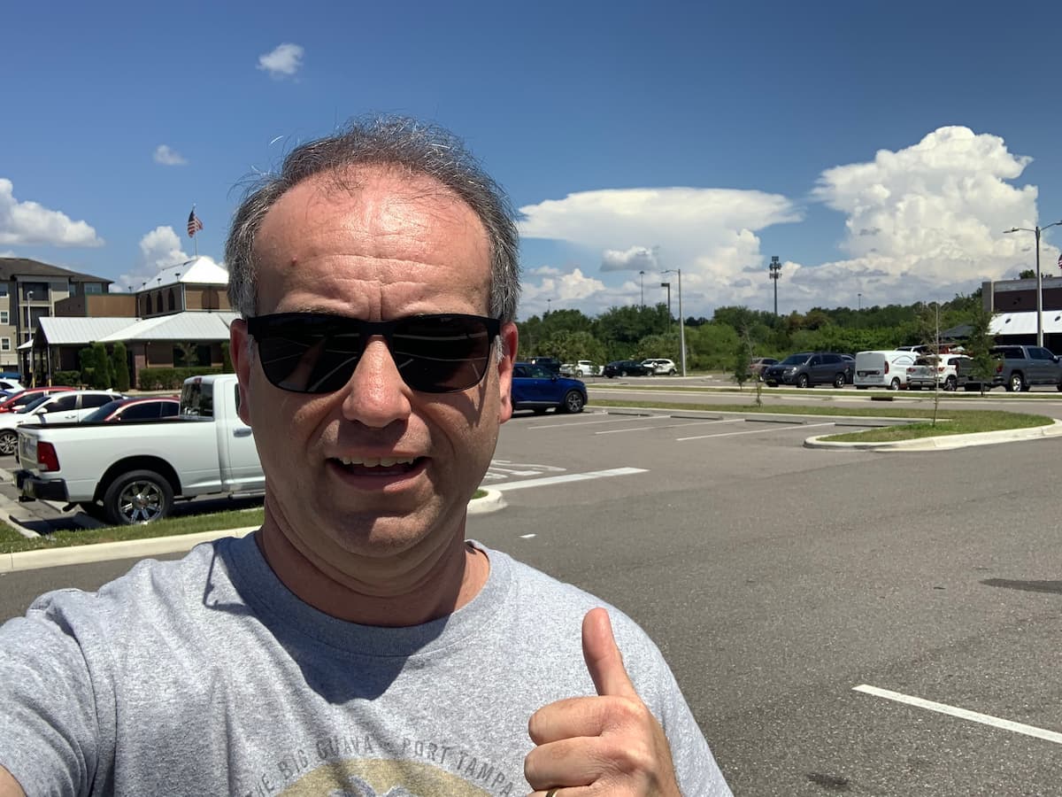 Check out that anvil cloud off in the distance behind me. Anvil clouds can become thunderheads and often cause stormy weather.