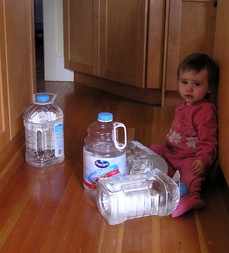 baby-playing-with-empty-water-jugs-by-qole-pejorian.jpg