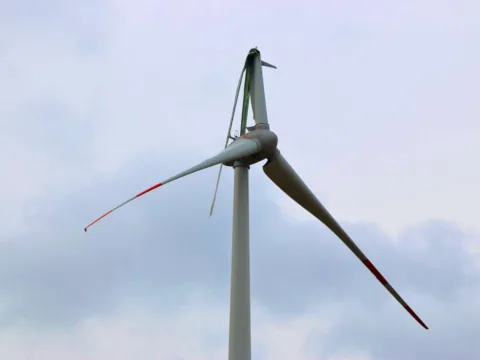 A broken wind turbine after a major storm.