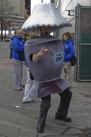 This is a homemade lamp costume - great for a DIY global warming costume. (The sign says, “Turn It Off!”)
