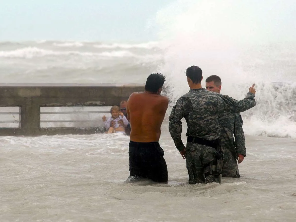 Storm surge waves strand people during a hurricane. 